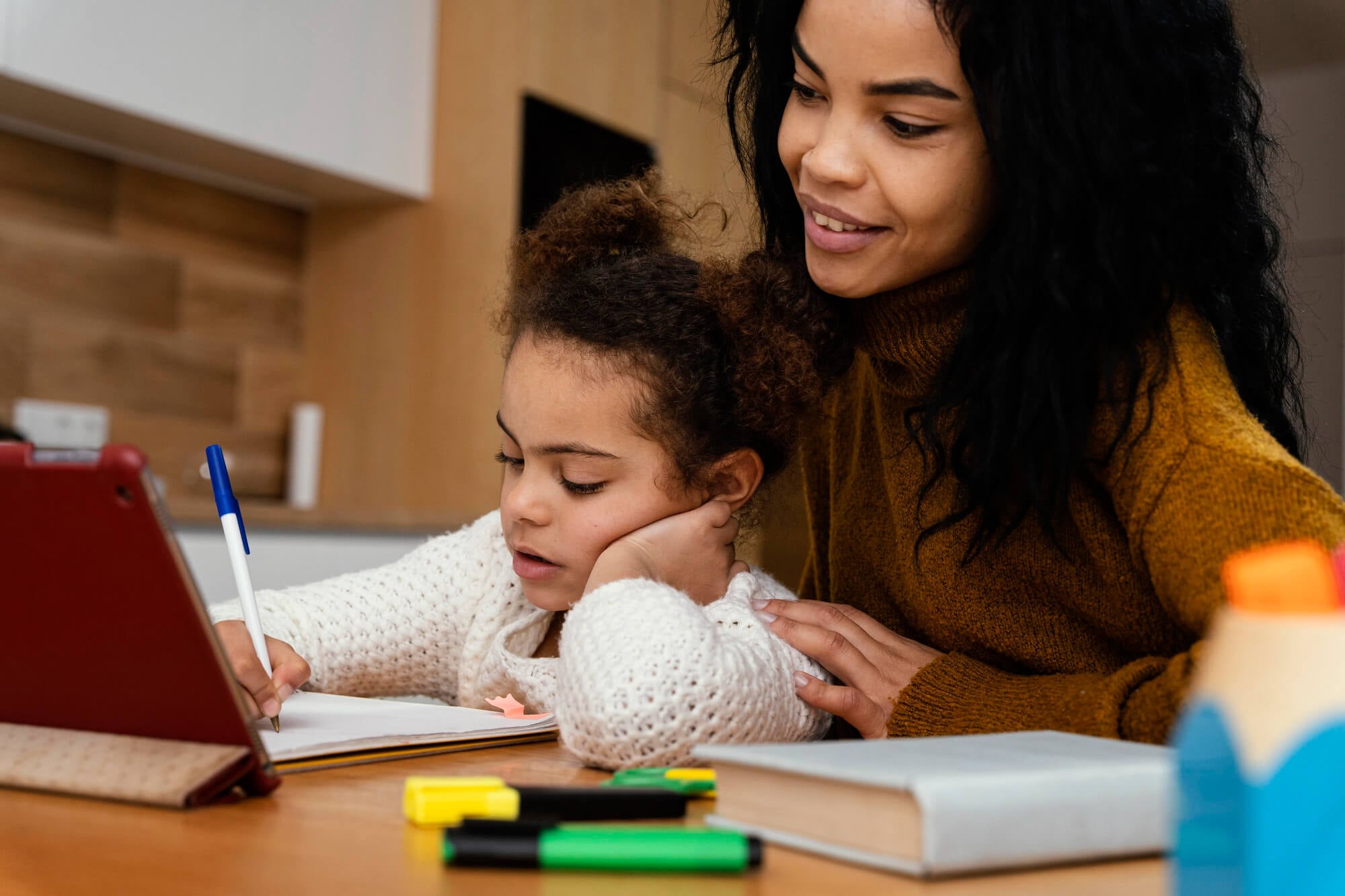 Teacher helping young student